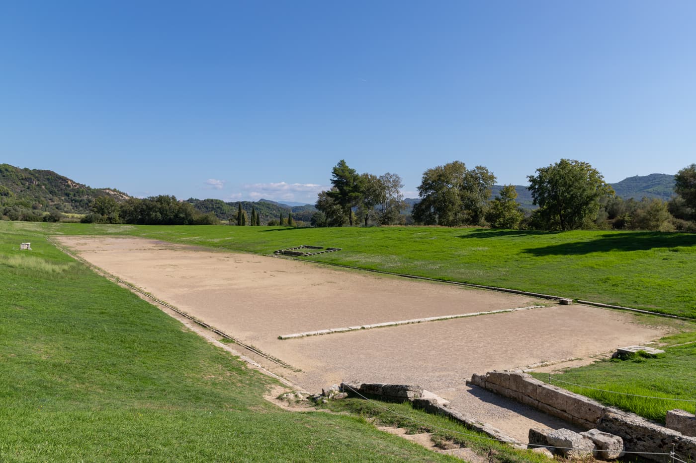 The ancient stadium of Olympia with its long earth track and grassy embankments