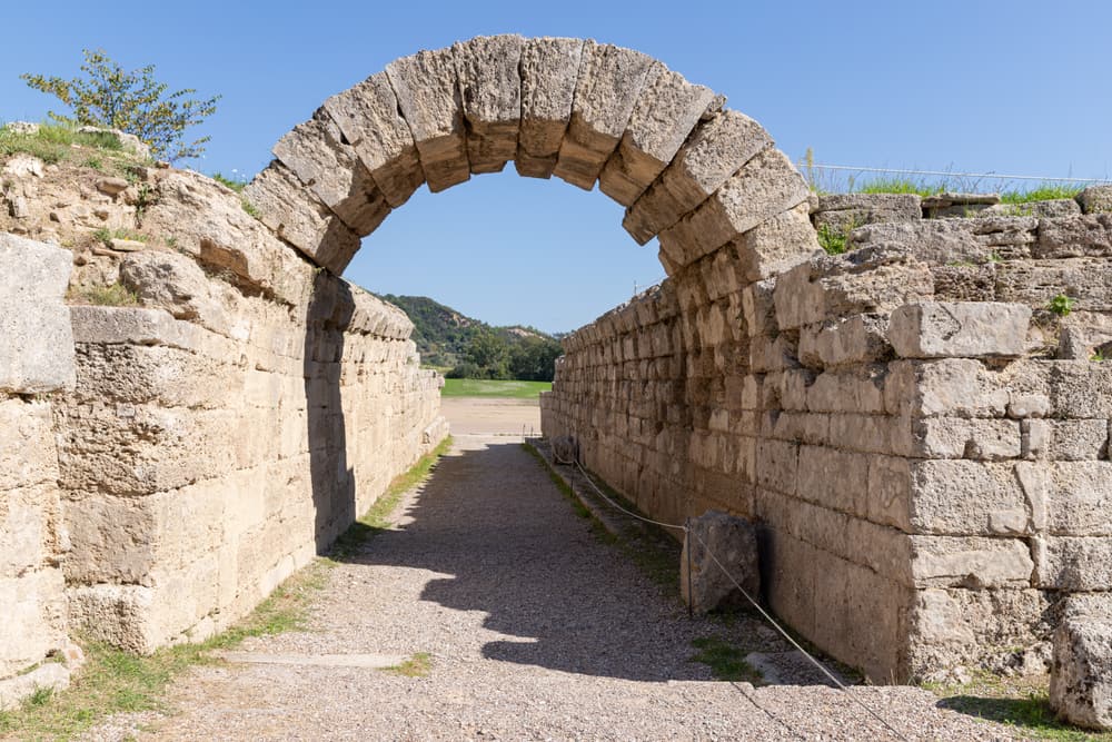 The vaulted stone tunnel leading into the ancient stadium of Olympia